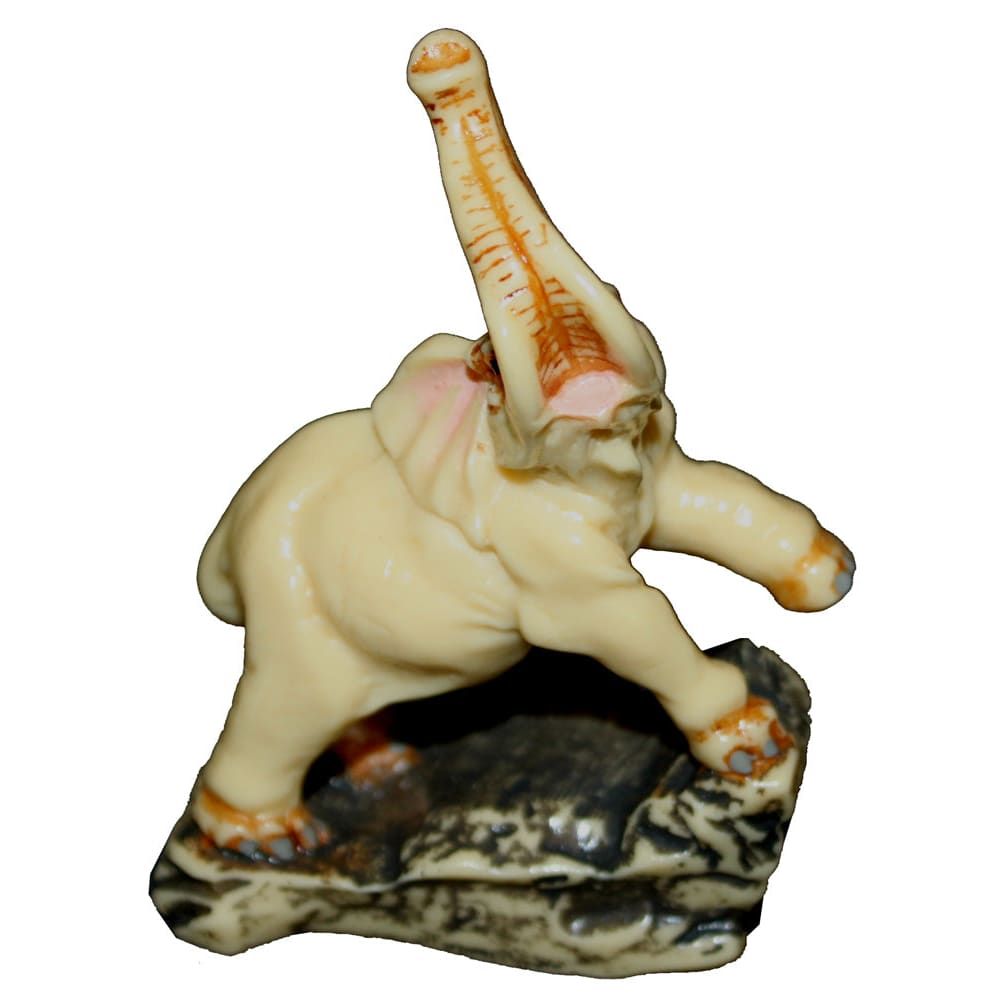3-inch ivory elephant figurine with raised trunk on a rocky base, Z-89 PF COOL BEANS.