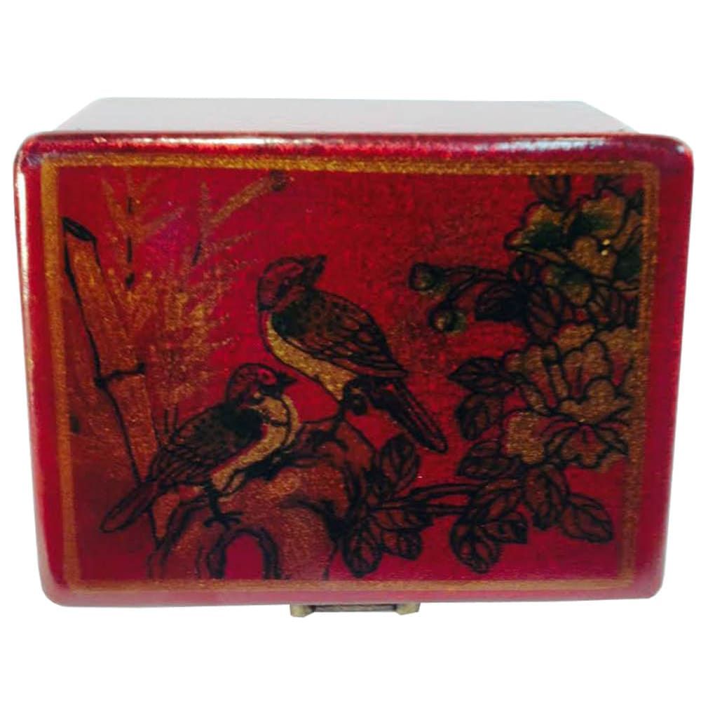 A red jewelry box with a black leather texture and a floral pattern featuring birds.