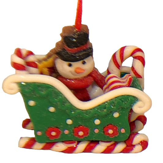 32943 - Claymatic 3D Snowman In Green Sleigh Ornament 4 Inch Tall Holiday |Pod 2-61|