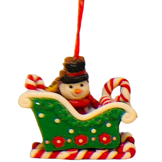 32943 - Claymatic 3D Snowman In Green Sleigh Ornament 4 Inch Tall Holiday |Pod 2-61|